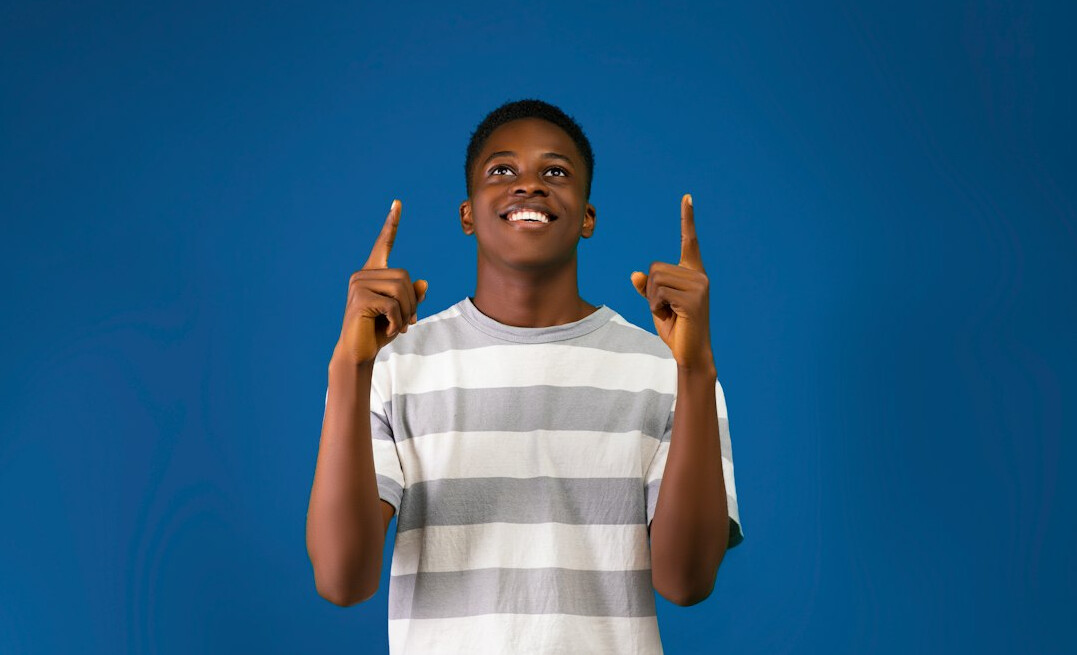 Studio portrait of a Black Brazilian man communication coach smiling