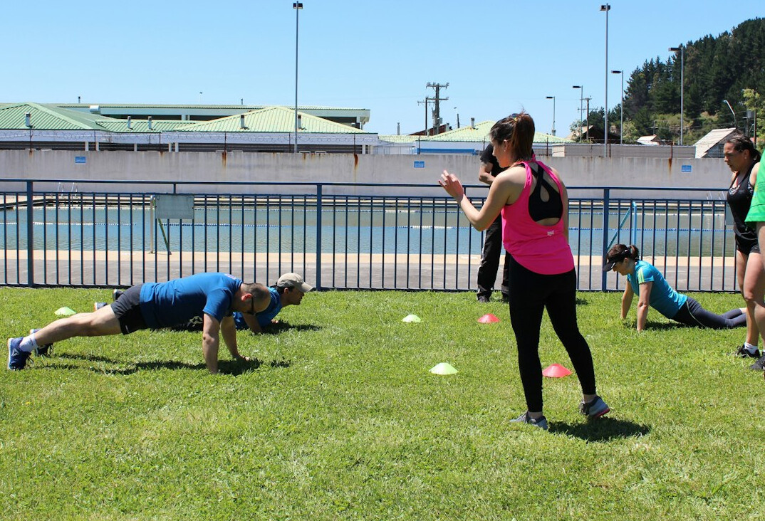 Instructor guiding a small group through an exercise